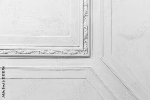 White wall with classic decoration, abstract interior fragment