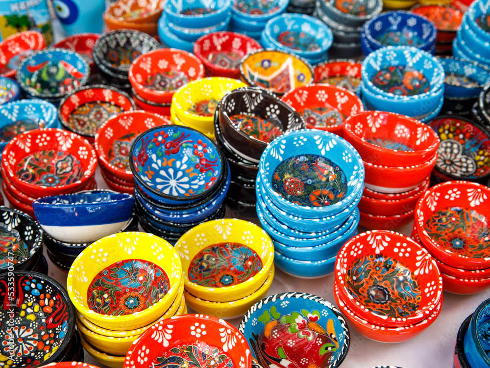 Authentic hand made Turkish ceramic bowls with vibrant bright colours and intricate hand painted design at local market. Sourced from Turkey. Can be used as home decor or for serving. Iznik pottery.