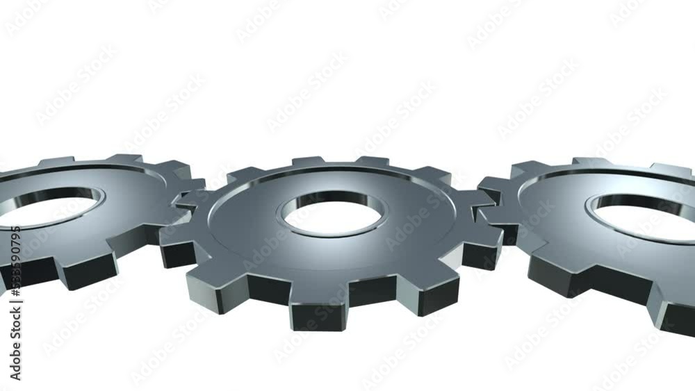 Metal gears rotate working interlocked together. Three silver rotating ...