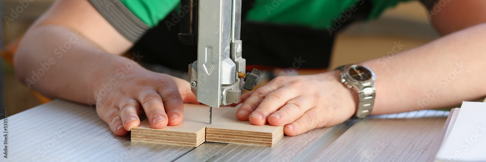 Worker using electric saw, handyman on workplace, diy Worker using electric saw, handyman on workplace, diy