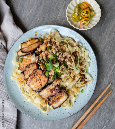 Delicious popular street food meal. Homemade Char Siu with Wanton Noodle and Stir Fry Ground Pork in Black Soy Sauce. For breakfast, lunch and dinner meals photo