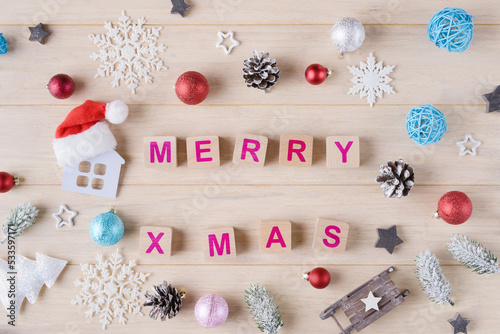 Christmas decoration and wooden cubes with words Merry Xmas. Christmas and New Year greeting concept