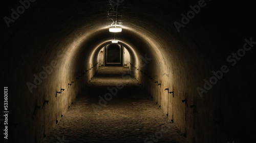 First person view walking through the military tunnel in the dungeon. Defensive structure  casemates. Bomb shelter during the war. Copy space for text