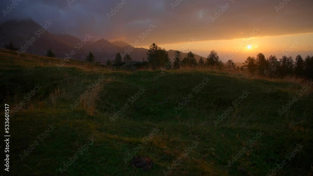 down to up movement with a gimbal of footage in the Slovenian mountains up in the alps at an incredible sunrise in beautiful colors with a camera going slowly forward down to up movement with a gimbal of footage in the Slovenian mountains up in the alps at an incredible sunrise in beautiful colors with a camera going slowly forward