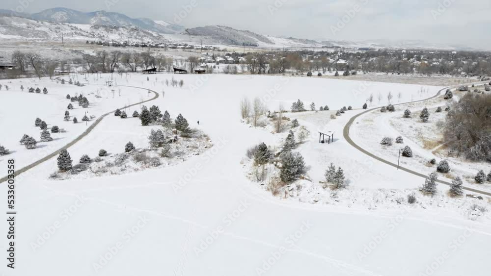 Man Walking in Snowy Fields with Trails Next to Park • Winter Scenery Snow Video • HD Aerial Drone Footage • Colorado Foothills Man Walking in Snowy Fields with Trails Next to Park • Winter Scenery Snow Video • HD Aerial Drone Footage • Colorado Foothills