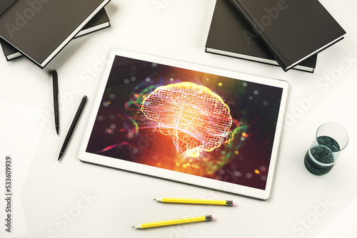 Top view of modern digital tablet monitor with creative artificial Intelligence symbol. Neural networks and machine learning concept. 3D Rendering