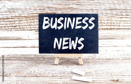 Canvas Print BUSINESS NEWS text on the Miniature chalkboard on wooden background
