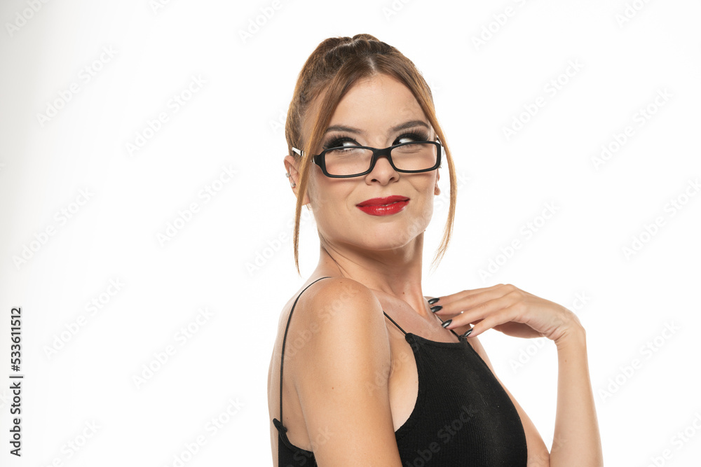 Portrait of a young smiling woman with make up, glasses and hairstyle on a white background Portrait of a young smiling woman with make up, glasses and hairstyle on a white background