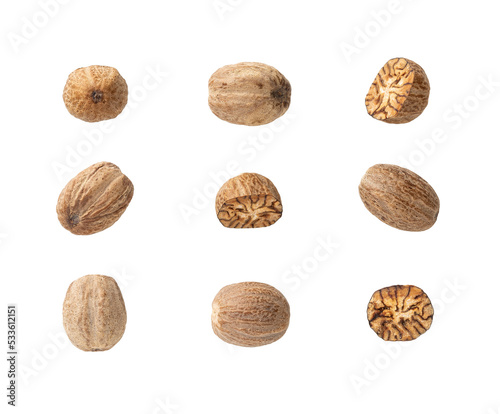Set of whole and halved nutmeg seeds cutout. Organic muscat seeds variety isolated on a white background. Spice concept. Dry fruits of Myristica fragrans tree for herbal medicine and cooking.