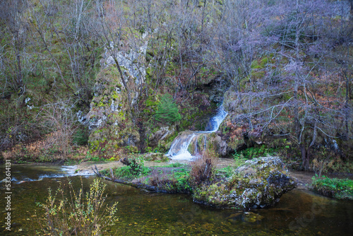 Beautiful forest waterfall  autumn day. Gostilje waterfall at mountain Zlatibor  Serbia. 