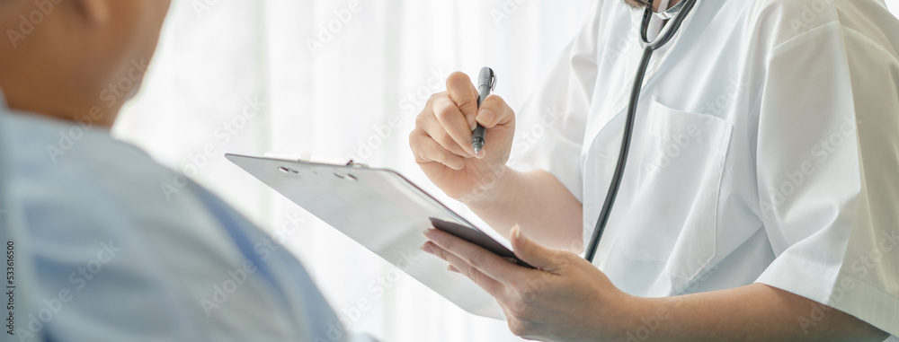 Doctor talking to elderly patient on the bed in hospital. Doctor talking to elderly patient on the bed in hospital.