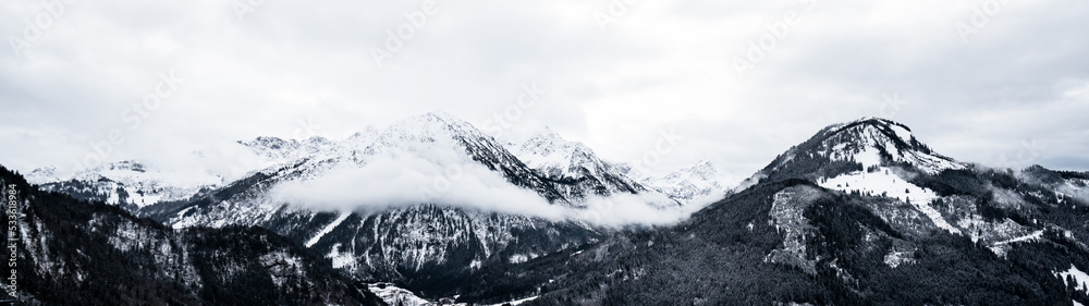 Amazing mystical rising fog forest snow snowy trees landscape snowscape in the mountains winter, Germany Allgäu panorama banner - dark mood