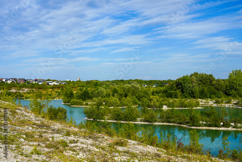 View of the Dyckerhoff lake in Beckum. Quarry west. Blue Lagoon. Landscape with a turquoise blue lake and the surrounding nature.
 photo