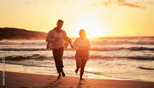 Silhouette couple, beach sunset and running outdoors on summer vacation, honeymoon travel and tropical vacation in Maldives. Shadow man, love woman and relaxing ocean, dusk and happy sea fun together