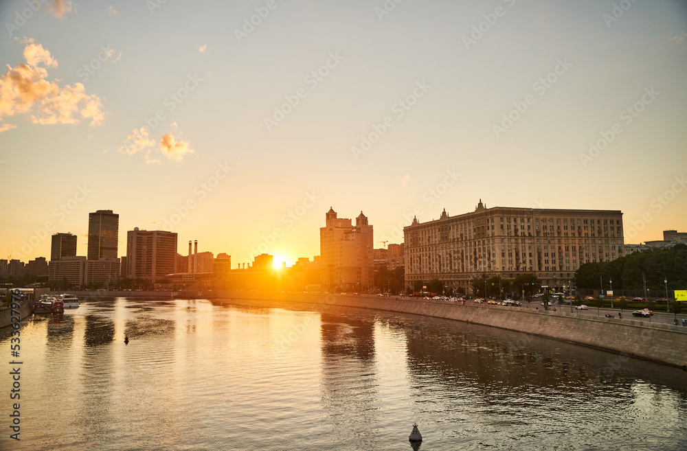 Moscow, Russia - 30.07.2022: View of the Moscow River and Moscow architecture at sunset