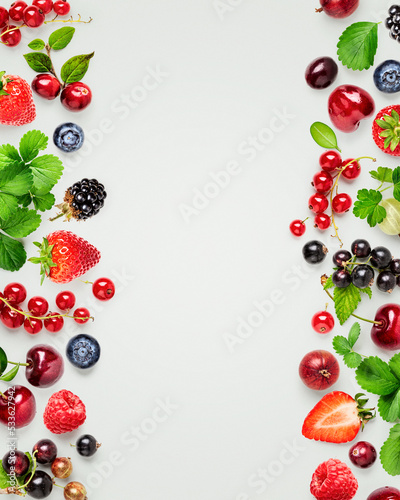 Berry fruits and leaves creative frame border. © ifiStudio
