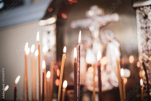 Photography church candles close-up, against the background of a specially blurred religious