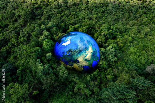 Fototapeta Naklejka Na Ścianę i Meble -  Atmospheric aerial view of the green forest with the earth Demonstrate the concept of preserving the top ecosystem and natural environment and Save Earth.