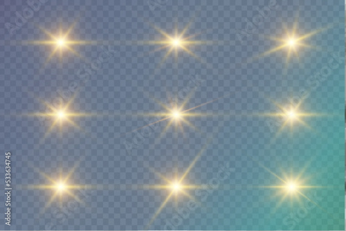 Set of golden glowing lights effects on transparent background. Sun flare with rays and spotlight. Glow effect. The star flared with brilliance.