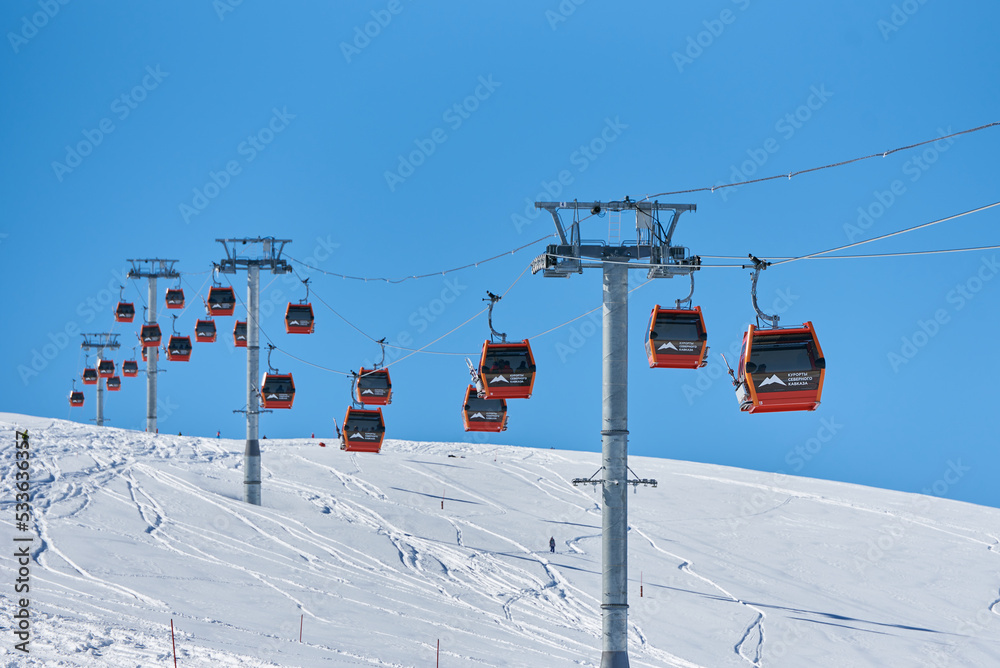 Ski lift in the snowy mountains of Arkhyz resort city in Russia Ski lift in the snowy mountains of Arkhyz resort city in Russia