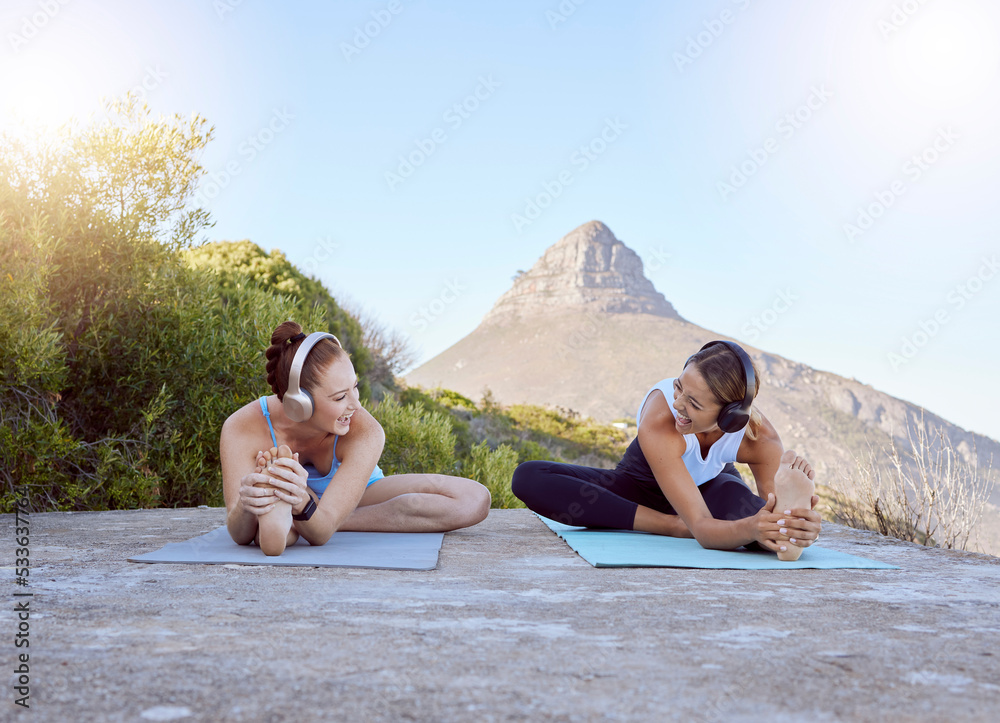 Yoga, friends and nature with a sports woman and female athlete training outdoor for exercise, workout and fitness. Health, music and zen with two women exercising outside on a mountain in nature