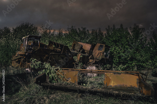 Abandoned combine harvester. Rusty spoiled combine harvester. Post-apocalyptic landscape.