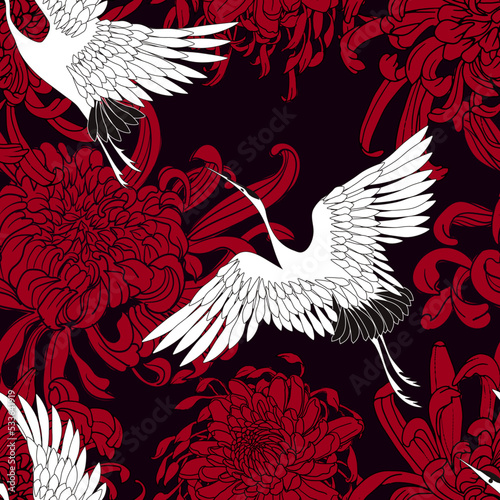 white cranes are flying on a black background with red chrysanthemums and peonies. Vector seamless pattern