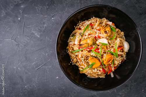 delicious chinese fried noodles on a black background