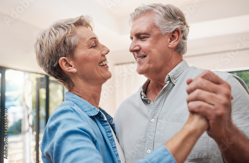 Elderly, happy and dancing couple in living room, enjoying retirement. Portrait of senior man and woman who dance together in their home, smiling, loving and romantic. Family, love and fun old people