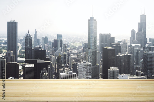 Empty tabletop made of wooden dies with Chicago city view at daytime on background  template