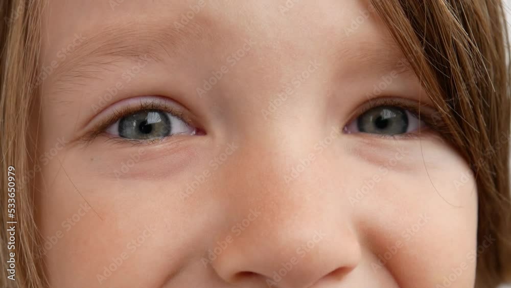 Close-up of beautiful child's eyes looking at the camera Close-up of beautiful child's eyes looking at the camera