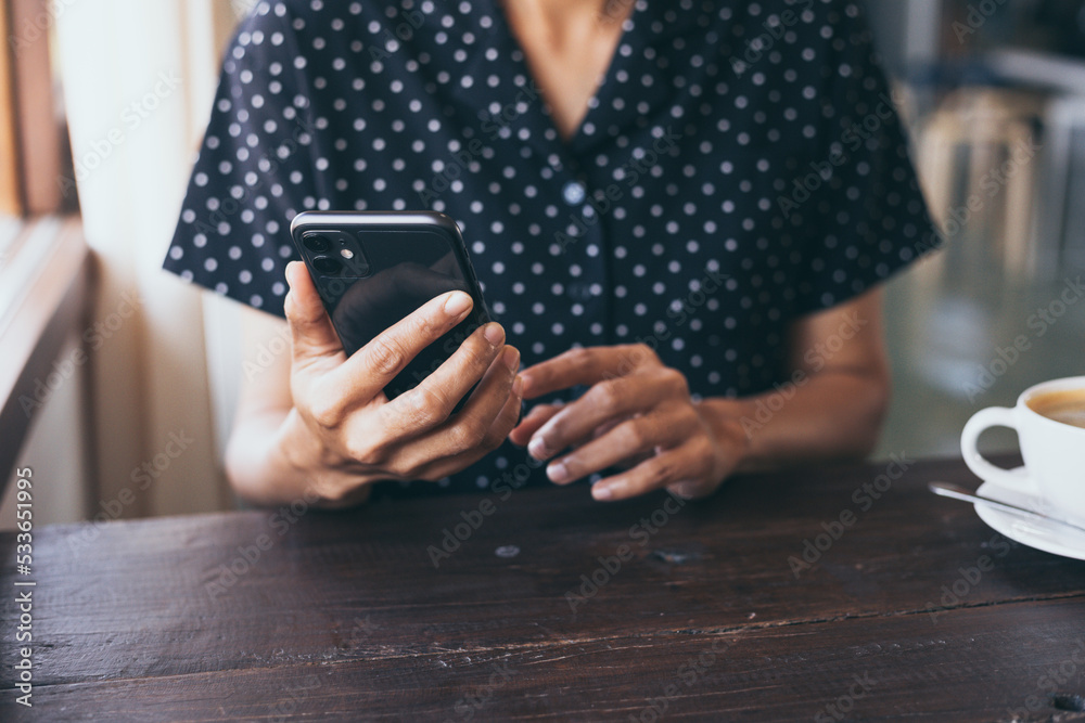 using cell phone hand holding mobile texting message contact us.chatting,search internet information in office.technology device communication connecting using cell phone hand holding mobile texting message contact us.chatting,search internet information in office.technology device communication connecting