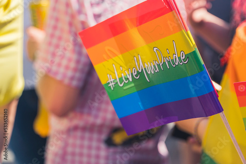 Warsaw Pride in Poland on June 25, 2022. The symbolic LGBT flag with a message LiveYourPride. High quality photo