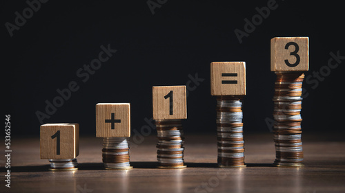 1+1=3 on wooden cubes. Synergy photo