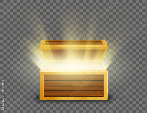 Open wooden old chest with glowing light inside