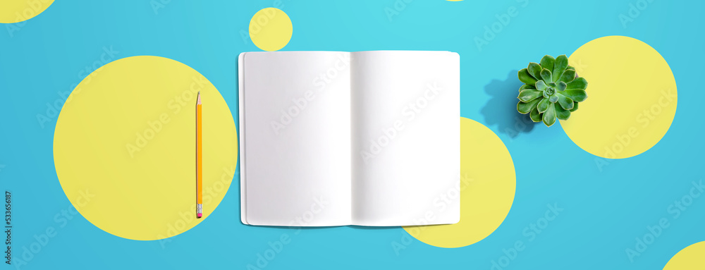 Blank white notebook from above - flat lay Blank white notebook from above - flat lay