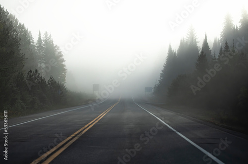 Early autumn morning fog on Highway 60 in Algonquin Park, Canada