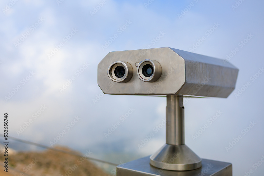 Paid binoculars for tourists in a resort place. Copy space background Paid binoculars for tourists in a resort place. Copy space background
