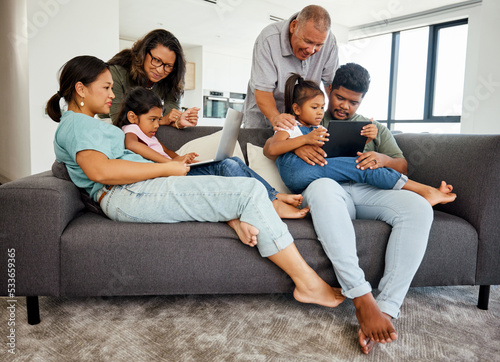 Family, children and technology with a kids, grandparents and parents streaming in the living room. Girl, sister and senior relatives watching an online subscription service together in their home
