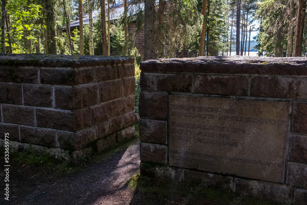 Fototapeta premium Norvajarvi, Rovaniemi Finland - August 8, 2022: German military cemetery in Norvajarvi was used to bring together the war graves in the northern part of Finland. Summer sunny day. Selective focus