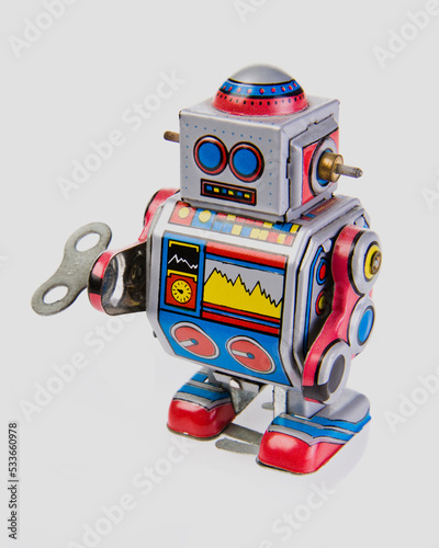 Vintage tin robot toy isolated on a white background