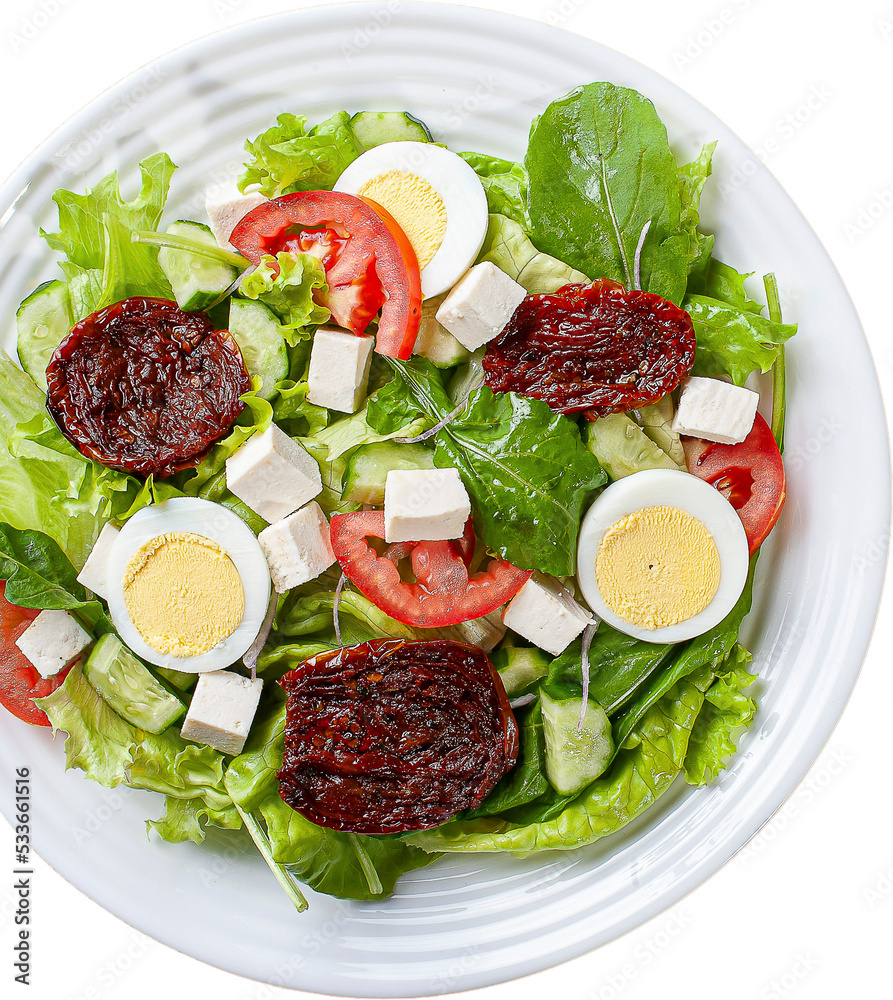 Green salad with lettuce, arugula, cucumber, cheese, sun-dried tomatoes and boiled egg. Green salad with lettuce, arugula, cucumber, cheese, sun-dried tomatoes and boiled egg.