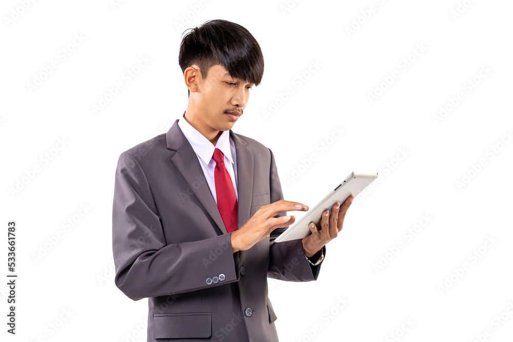 Asian male student wearing gray suit using tablet computer isolated on white background. Asian male student wearing gray suit using tablet computer isolated on white background.
