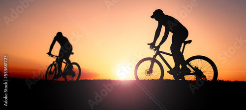 Beautiful light mountain biker silhouette. adventure sports concept