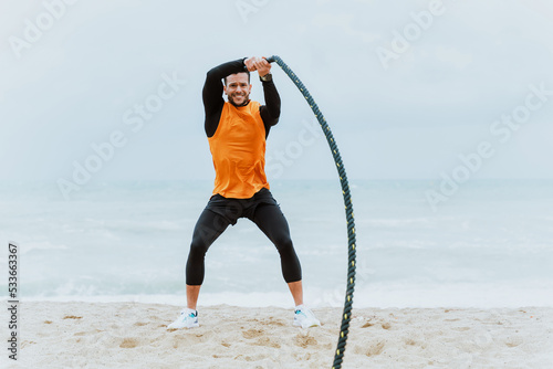 Young athlete training in the morning on the beach at the gym. outdoor. Representation of sport and healthy lifestyle concepts