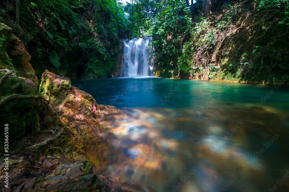 Fototapeta premium Beautiful blue waterfall quite and calming