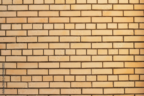 beige brick wall background as a textured surface