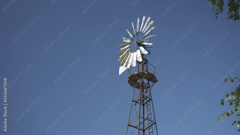 Windmill Weather Vane. View at Dawn of an Old and Abandoned Weather Vane Windmill Weather Vane. View at Dawn of an Old and Abandoned Weather Vane