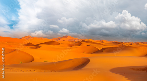 Beautiful sand dunes in the Sahara desert with amazing stormy clouds - Sahara, Morocco