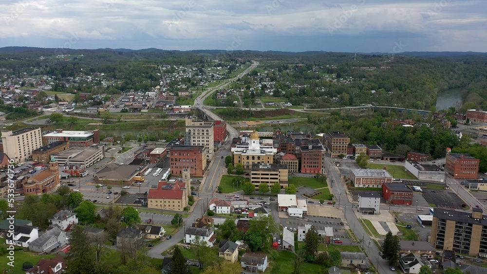 Wide angle view of the Marion County courthouse in Fairmont, WV, and the surrounding small town river and countryside in the appalachian mountains.